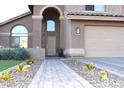 Front entrance with a walkway and desert landscaping at 7243 E Nopal Ave, Mesa, AZ 85209