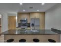 Modern kitchen with stainless steel appliances and granite countertops at 7121 E Rancho Vista Dr # 4004, Scottsdale, AZ 85251