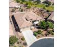Single-story home with tile roof, driveway, and desert landscaping at 41906 W Solitare Dr, Maricopa, AZ 85138