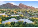 Aerial view showcasing a luxury home and surrounding mountain views at 6301 N 51St Pl, Paradise Valley, AZ 85253