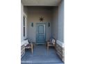 Covered front porch with seating area at 30893 W Pinchot W Ct, Buckeye, AZ 85396