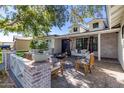 Inviting front porch with fire pit and seating area, perfect for relaxing outdoors at 3410 N 45Th Pl, Phoenix, AZ 85018