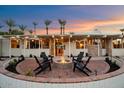 Brick patio with fire pit and comfortable seating area at 5215 E Lafayette Blvd, Phoenix, AZ 85018