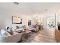 Open living space with modern furniture and wood floors at 15163 W Cameron Dr, Surprise, AZ 85379