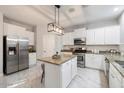 Modern kitchen with white cabinets, granite counters at 15163 W Cameron Dr, Surprise, AZ 85379
