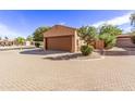 Attached garage with driveway and desert landscaping at 3047 E Fremont Rd, Phoenix, AZ 85042