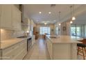 Open kitchen with large island and stainless steel appliances at 27552 W Tonopah Dr, Buckeye, AZ 85396
