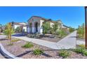 Landscaped home exterior with a walkway and driveway at 9515 E Rainbow Ave, Mesa, AZ 85212