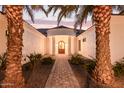 Stunning curb appeal! This home features a welcoming entryway and nicely landscaped grounds at 22474 S 199Th Cir, Queen Creek, AZ 85142