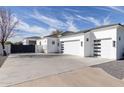 Three-car garage with modern finishes and ample parking space at 22474 S 199Th Cir, Queen Creek, AZ 85142