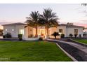 Luxury home with palm trees and a walkway at 22474 S 199Th Cir, Queen Creek, AZ 85142