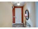 Bright entryway with a glass-top table and mirror at 697 W Twin Peaks Pkwy, San Tan Valley, AZ 85143