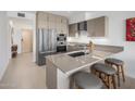 Modern kitchen with stainless steel appliances and an island with seating at 7180 E Kierland Blvd # 314, Scottsdale, AZ 85254