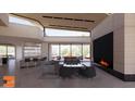 Modern living room with fireplace and wet bar at 6612 E Hummingbird Ln, Paradise Valley, AZ 85253