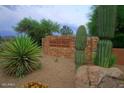 Pinnacle Peak entry sign with desert landscaping at 8307 E Vista De Valle --, Scottsdale, AZ 85255