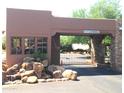 Gated community entrance with stone accents at 8307 E Vista De Valle --, Scottsdale, AZ 85255
