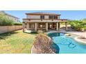 Inviting backyard oasis with a sparkling pool and grassy lawn at 19435 N 62Nd Ave, Glendale, AZ 85308