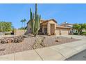 Beautiful two-story home with a manicured front yard and desert landscaping at 19435 N 62Nd Ave, Glendale, AZ 85308