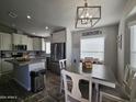 Modern kitchen with stainless steel appliances and an island at 650 N Hawes Rd # 3314, Mesa, AZ 85207