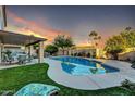 Relaxing backyard with a sparkling pool and patio furniture at 13801 N 30Th St, Phoenix, AZ 85032