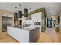 Modern kitchen with large island and stainless steel appliances at 37200 N Cave Creek Rd # 1126, Scottsdale, AZ 85262