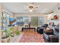 Cozy Gathering room with comfortable seating and large windows at 10317 W Prairie Hills Cir, Sun City, AZ 85351