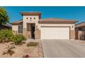 One-story home with two-car garage and desert landscaping at 18046 W Palo Verde Ave, Waddell, AZ 85355