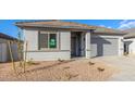 Newly built single-story home with gray siding and a two-car garage at 7366 E White Tail Rd, San Tan Valley, AZ 85143