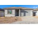 Newly built single-story home with gray siding and two-car garage at 7366 E White Tail Rd, San Tan Valley, AZ 85143