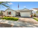 Front view of a single-story house with a landscaped yard and a two-car garage at 20428 W Elm Dr, Buckeye, AZ 85396