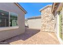 Brick paved courtyard with exterior access to home at 15898 S 177Th Dr, Goodyear, AZ 85338