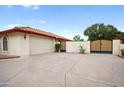 Attached garage with double gates and a large driveway at 591 E Park Ave, Gilbert, AZ 85234