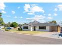 Mid-century modern home with landscaped yard and mountain view at 1455 E Tuckey Ln, Phoenix, AZ 85014