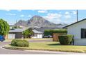 Residential neighborhood with mountain views and lush landscaping at 1455 E Tuckey Ln, Phoenix, AZ 85014