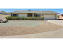 Ranch style home with mature landscaping and a two-car garage at 20026 N 106Th Ave, Sun City, AZ 85373