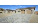 New construction home with beige facade and three-car garage at 13272 E La Junta Rd, Scottsdale, AZ 85255