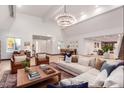 Bright and spacious living room with a large sectional sofa and high ceilings at 3014 N 61St Pl, Scottsdale, AZ 85251