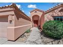 Entryway with a red door and desert landscaping at 16914 E Britt Ct, Fountain Hills, AZ 85268
