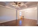 Spacious dining room with hardwood floors, high ceilings, and chandelier at 17186 W Post Dr, Surprise, AZ 85388