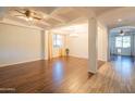 Spacious dining room with hardwood floors, high ceilings, and chandelier at 17186 W Post Dr, Surprise, AZ 85388
