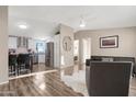 Open floor plan kitchen and living area with hardwood flooring at 52320 W Foothill Trl, Maricopa, AZ 85139