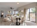 Bright dining area with access to a patio and modern furnishings at 930 N Mesa Dr # 1039, Mesa, AZ 85201