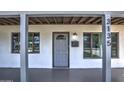 Front entrance with covered porch and gray door at 3135 N 34Th St, Phoenix, AZ 85018
