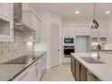 Sleek kitchen with contemporary cabinetry and a built-in cooktop at 15528 E Chicory Dr, Fountain Hills, AZ 85268