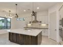 Spacious kitchen boasts modern cabinetry, a large island, and high-end appliances at 15528 E Chicory Dr, Fountain Hills, AZ 85268