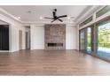 Spacious living room with fireplace and sliding glass doors leading to patio at 15522 E Chicory Dr, Fountain Hills, AZ 85268