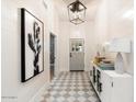 Bright entryway with geometric tile floor and modern console at 8014 E Del Tesoro Dr, Scottsdale, AZ 85258