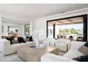 Bright and airy living room with large windows and access to backyard at 5815 N Kiva Ln, Paradise Valley, AZ 85253
