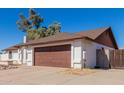 Single story home with a large driveway and gated entrance at 6420 E Jensen St, Mesa, AZ 85205