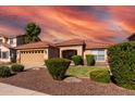 One-story home with tan exterior, red tile roof, and landscaped yard at 2754 W Tanner Ranch Rd, San Tan Valley, AZ 85144